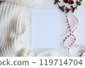 Blank Card with Cozy Knit Fabric and Festive Ribbon for Christmas or Holiday Greeting Template. Christmas mockup 119714704