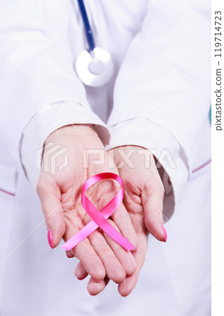 Female hands with pink ribbon Female hands with pink ribbon 119714723