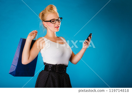 Pin up woman with shopping bag and phone. Pin up woman with shopping bag and phone. 119714818