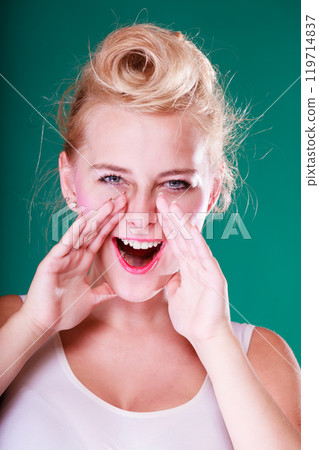 Lovely young girl screaming, hands close to mouth Lovely young girl screaming, hands close to mouth 119714837