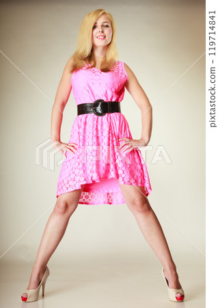 Lovely young girl wearing short pink dress Lovely young girl wearing short pink dress 119714841