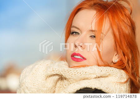Beauty face red hair woman in warm clothing outdoor Beauty face red hair woman in warm clothing outdoor 119714878