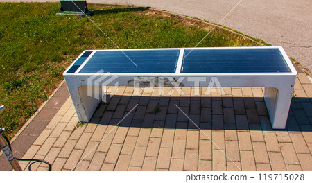 Bench with solar panels at the bike stand. Alternative energy source. Energy crisis. 119715028