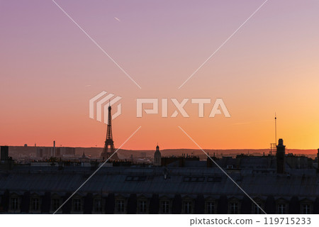 View of Paris and Eiffel Tower and rooftops from above. Beautiful sunset over Paris, France View of Paris and Eiffel Tower and rooftops from above. Beautiful sunset over Paris, France 119715233