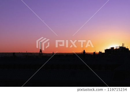 View of Paris and Eiffel Tower and rooftops from above. Beautiful sunset over Paris, France 119715234