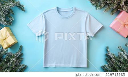 Light blue t-shirt with gift boxes and pine branches on blue background 119715685