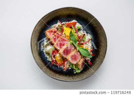 Seared tuna salad with fresh vegetables, citrus slices and parmesan. Gourmet and healthy meal option Seared tuna salad with fresh vegetables, citrus slices and parmesan. Gourmet and healthy meal option 119716249