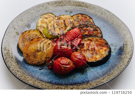 Grilled vegetables platter with zucchini, eggplant, peppers, and tomatoes for a healthy dish Grilled vegetables platter with zucchini, eggplant, peppers, and tomatoes for a healthy dish 119716250