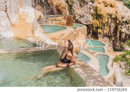 Female tourist at the hot springs of Grutas Tolantongo, Mexico. Adventure, relaxation, and natural wellness concept 119716269
