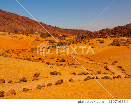 spot in Tenerife with many red rocks and beautiful mountain landscape background 119716284