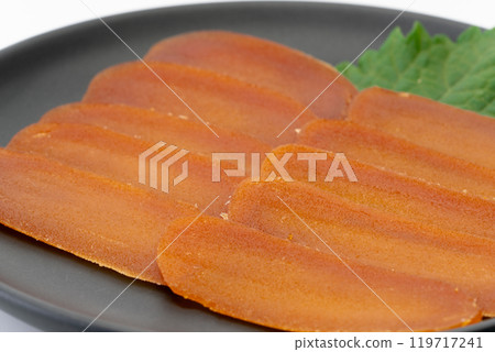 Close-up of thinly sliced dried mullet roe 119717241