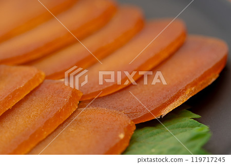 Close-up of thinly sliced dried mullet roe 119717245