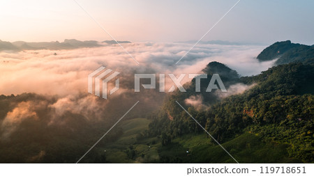 Aerial View of Morning fog and mountains as the sun rises from above Aerial View of Morning fog and mountains as the sun rises from above 119718651