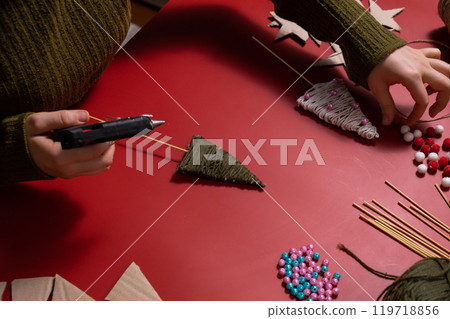 Christmas trees made of rope Sustainable Christmas preparation Diy process of making handmade decor. Step by step activity for children. Inclusive and responsible stress relief holiday hobby Christmas trees made of rope Sustainable Christmas preparation Diy process of making handmade decor. Step by step activity for children. Inclusive and responsible stress relief holiday hobby 119718856