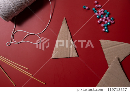 Rope Christmas trees Storytelling creating craft Christmas holiday present. Tactile hand-on activity. Master class progress of creative me-made gifts. Seasonal domestic life micro moment hobby Rope Christmas trees Storytelling creating craft Christmas holiday present. Tactile hand-on activity. Master class progress of creative me-made gifts. Seasonal domestic life micro moment hobby 119718857