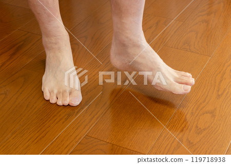 Lift one leg on the floor 119718938