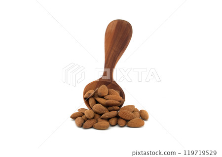 Wooden spoon with almonds isolated on white background 119719529