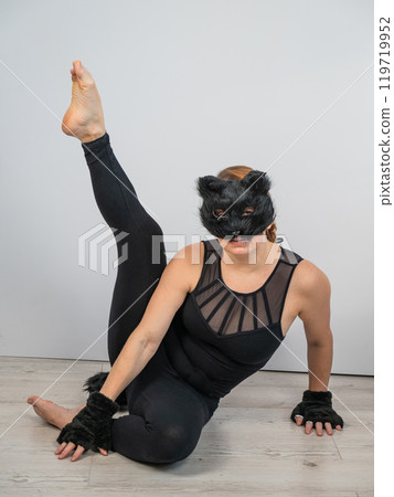 Caucasian woman in cat costume on white background. Quadrober. Caucasian woman in cat costume on white background. Quadrober. 119719952