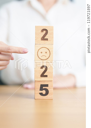 Happy New Year 2025 with Sad face block. Satisfaction, feedback, Review, mental health, eco sustainable and bad year concept 119721897