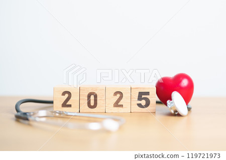 Happy New Year 2025 with Stethoscope of doctor and heart shape on table. health care, Insurance, Wellness and medical concept Happy New Year 2025 with Stethoscope of doctor and heart shape on table. health care, Insurance, Wellness and medical concept 119721973