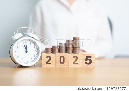 Happy New Year 2025 with clock and coins stack arrangement. Money Saving for Future Plan, Retirement fund, Pension, Investment, Wealth Business, Financial and countdown concepts 119722377