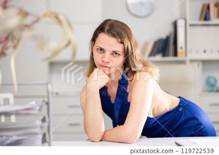 Portrait of naked woman cleaner standing in office Portrait of naked woman cleaner standing in office 119722539