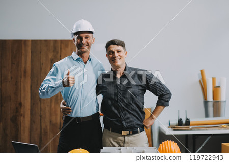 Team Engineers with draft plan of building on constructing site. Engineer work on site. engineer visit and inspection site engineer. Inspector engineer check and working on site. 119722943