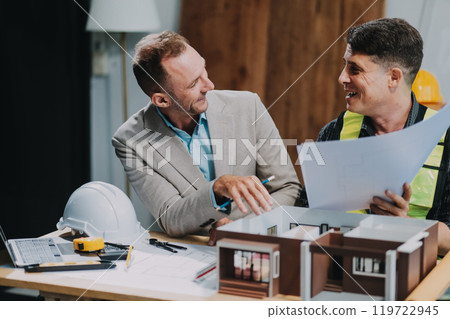 Team Engineers with draft plan of building on constructing site. Engineer work on site. engineer visit and inspection site engineer. Inspector engineer check and working on site. Team Engineers with draft plan of building on constructing site. Engineer work on site. engineer visit and inspection site engineer. Inspector engineer check and working on site. 119722945