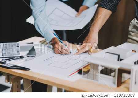 Team Engineers with draft plan of building on constructing site. Engineer work on site. engineer visit and inspection site engineer. Inspector engineer check and working on site. 119723398