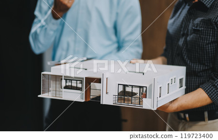 Team Engineers with draft plan of building on constructing site. Engineer work on site. engineer visit and inspection site engineer. Inspector engineer check and working on site. 119723400