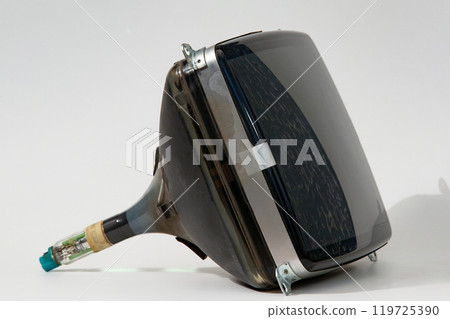 The kinescope of an old TV or monitor lies on a white background 119725390