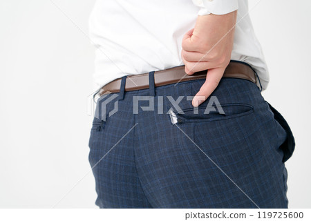Businessman, male in his 20s, pants torn, pointing 119725600