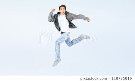 Full body photo of a man in casual clothing jumping Full body photo of a man in casual clothing jumping 119725919