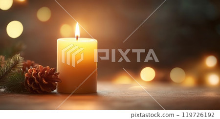 Christmas candle with soft glow and pinecone decoration for holiday ambiance Christmas candle with soft glow and pinecone decoration for holiday ambiance 119726192