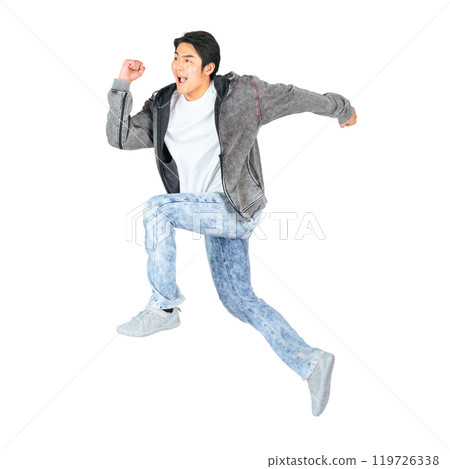 A man in casual clothing jumping. A transparent full-body photo PNG precisely cut by hand 119726338