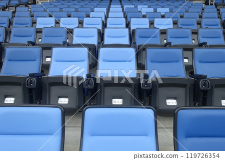 Seats lined up in the stadium 119726354