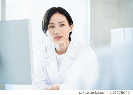 A lady in white 119726643