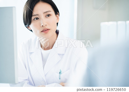 A lady in white A lady in white 119726650