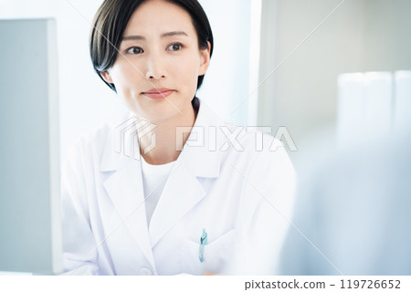 A lady in white 119726652