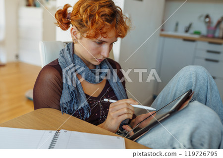 Woman using tablet, e-learning 119726795