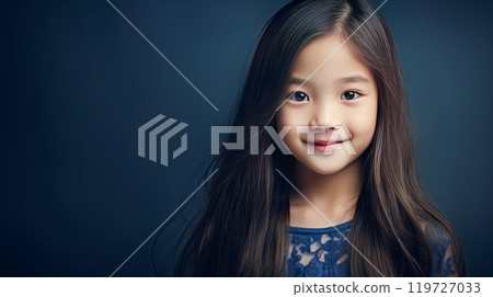 Portrait of smiling asian girl child with long white hair blue background. 119727033
