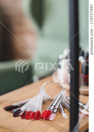 Nail polish samples in different bright colors. Colorful nail lacquer manicure swatches. Top view of nail art wheel palette 119727987