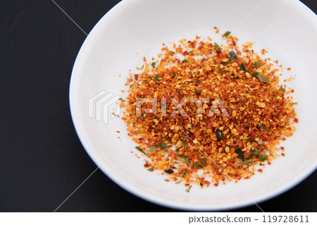 Yuzu shichimi in a white dish Yuzu shichimi in a white dish 119728611