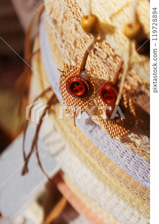 a detailed closeup image of a hats with decor beads close -up 119728894