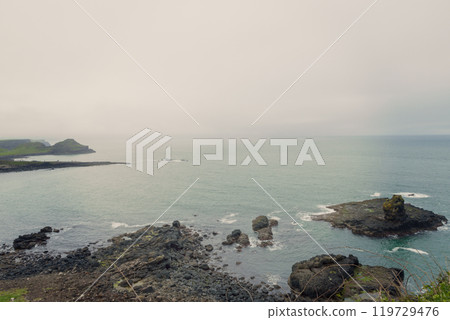 Coastal view Giant Causeway Northern Ireland rugged rocks calm sea vintage style moody Coastal view Giant Causeway Northern Ireland rugged rocks calm sea vintage style moody 119729476