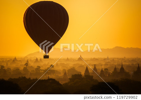 Balloon over plain of Bagan in misty morning, Myanmar 119729902