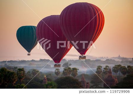 Balloon over plain of Bagan in misty morning, Myanmar Balloon over plain of Bagan in misty morning, Myanmar 119729906