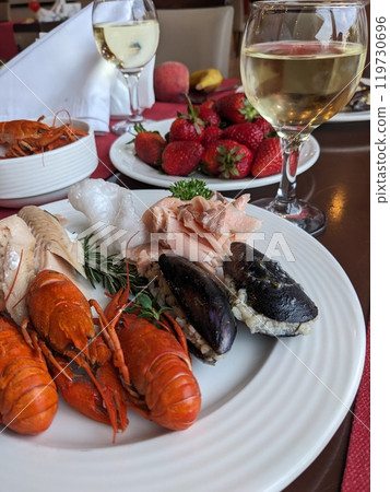 Boiled red crayfish in a plate served on the table for dinner Boiled red crayfish in a plate served on the table for dinner 119730696