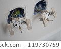 Pair of electrical socket on the wall 119730759