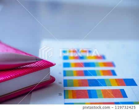 Graphs and notebooks on the table Graphs and notebooks on the table 119732425